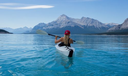 Girl, kayak, lake — How to Enjoy the Manaslu Circuit Trek with a Group